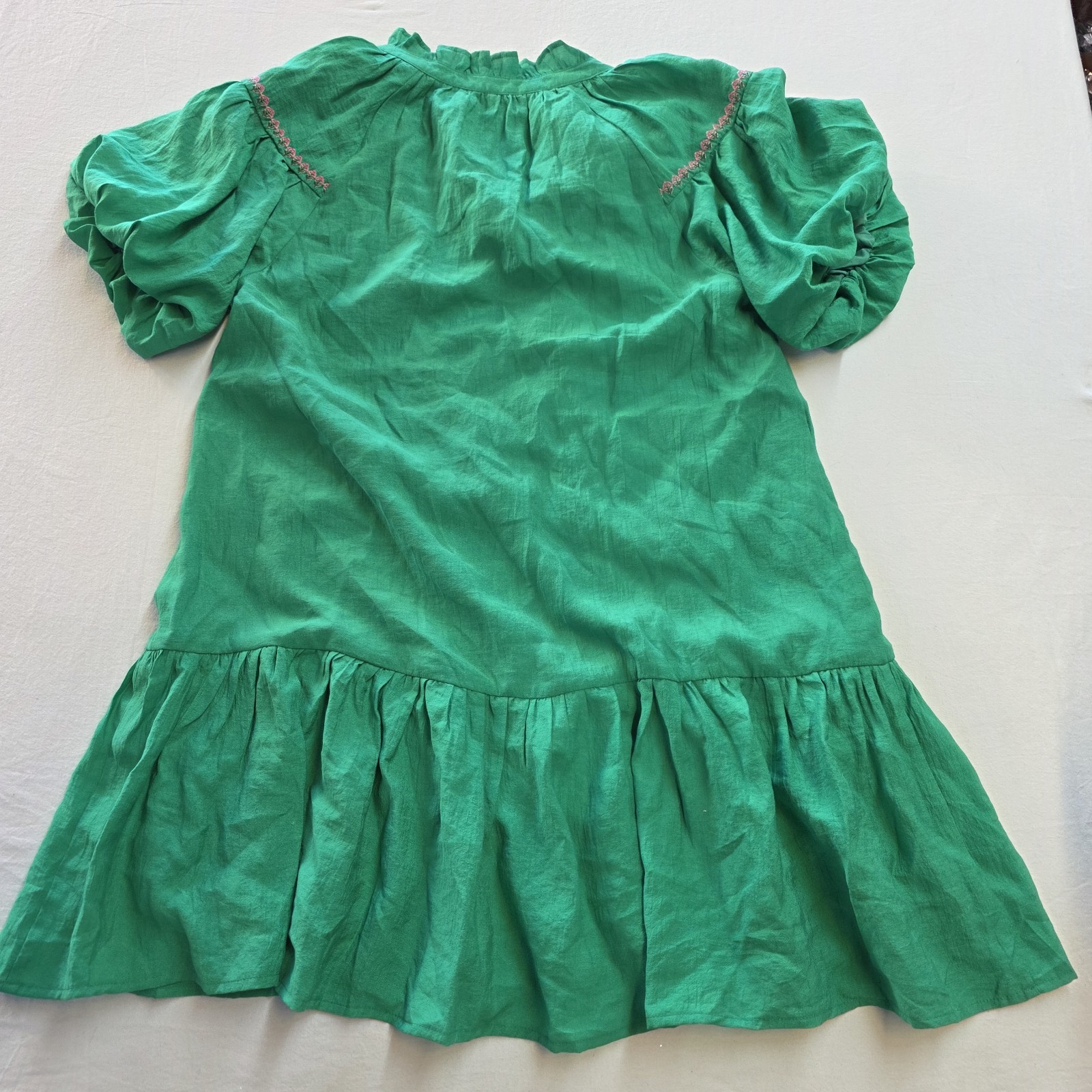 Umgee green dress features distinct floral embroidery and a charming drop waist