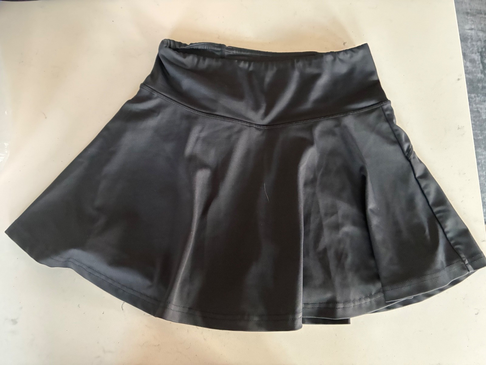 CVG Constantly Varied Gear Black Skort with zipper pocket at back