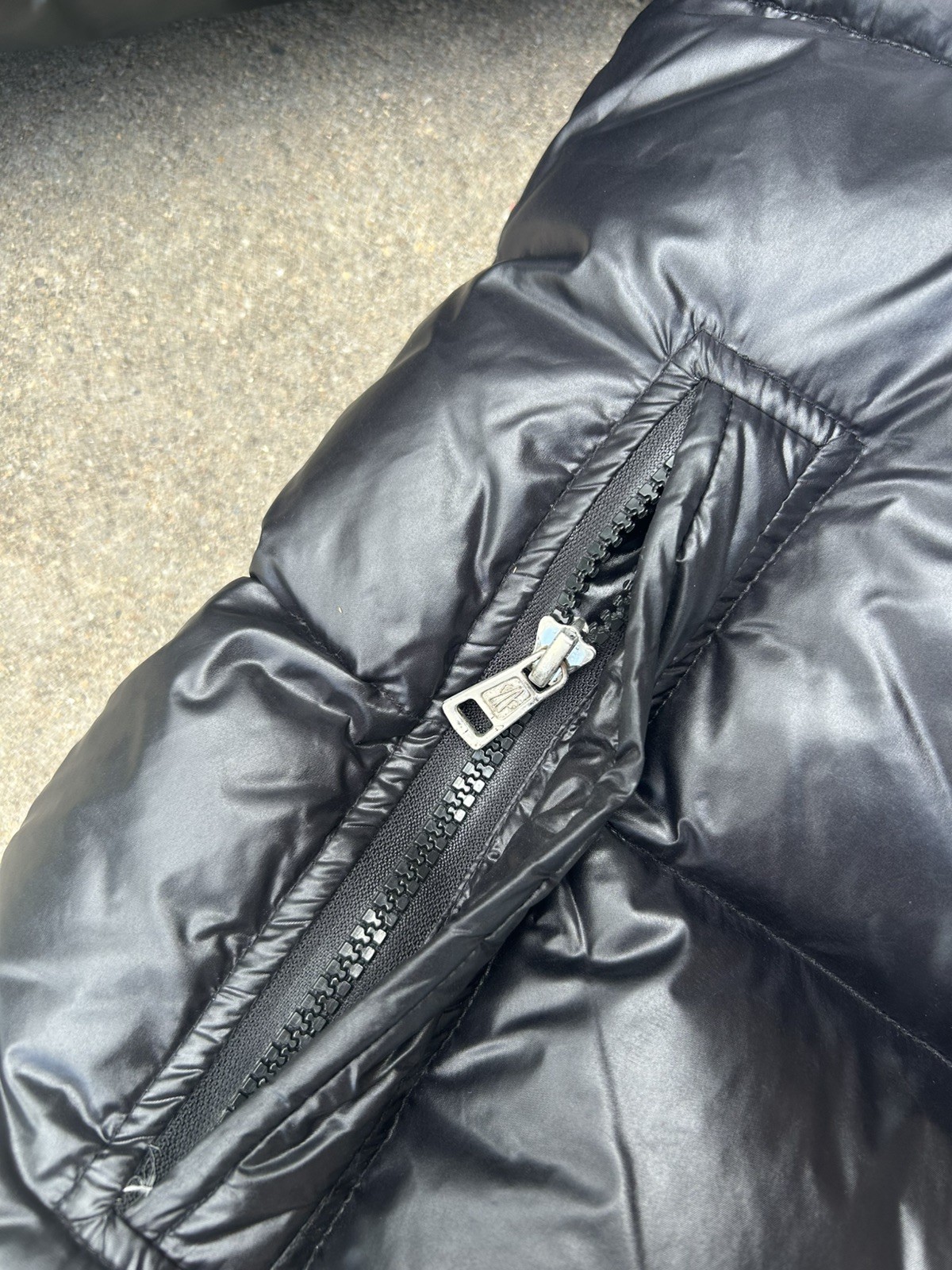 Moncler Black Insulated Zip Up Puffer Jacket with Logo & Zipper Accents
