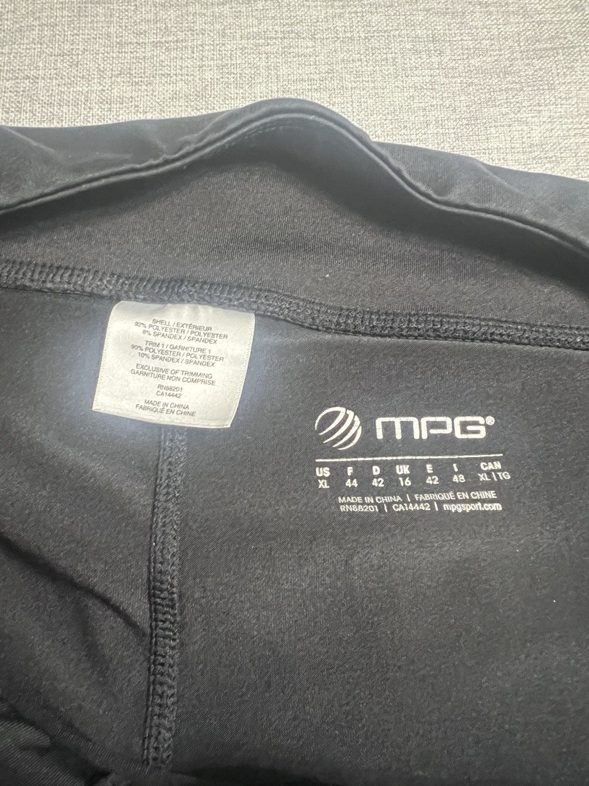 MPG branded black mini tennis Skirt With Built In Shorts. Smooth stretch fabric.