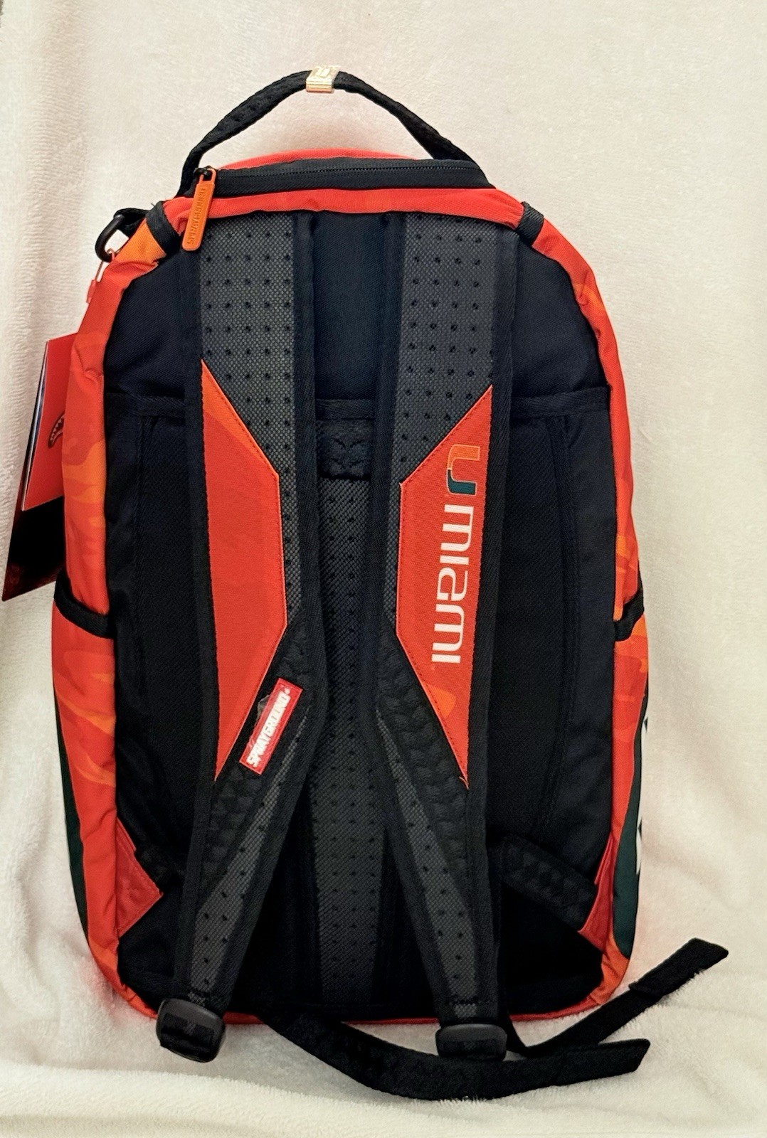 UM UNIVERSITY OF MIAMI FOOTBALL SPRAYGROUND BACKPACK MASCOT SEBASTIAN NEW IN BAG