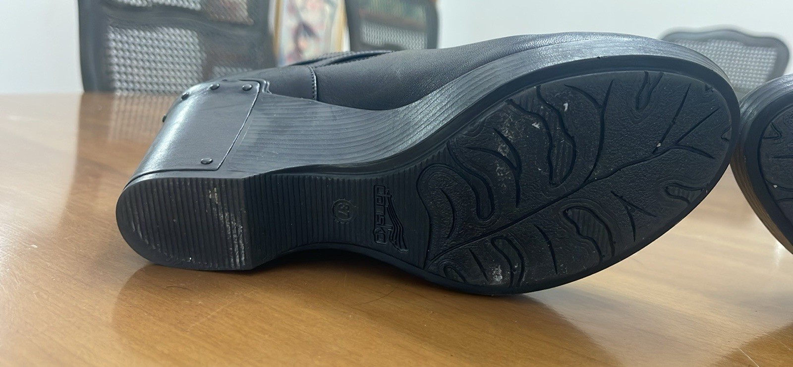 Dansko 37 Black Clogs with Buckle Strap and Metal Tooling on the Heel