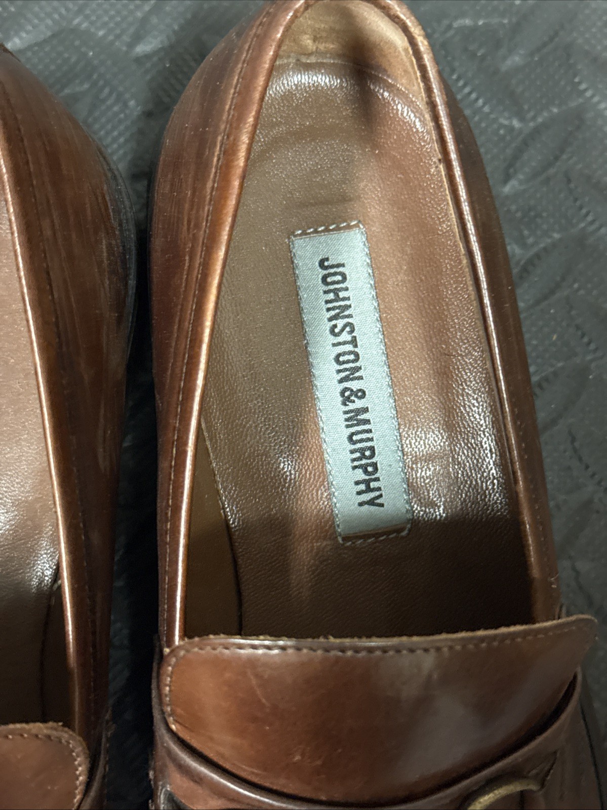 Three Pairs of Johnston and Murphy slip on shoes 9.5
