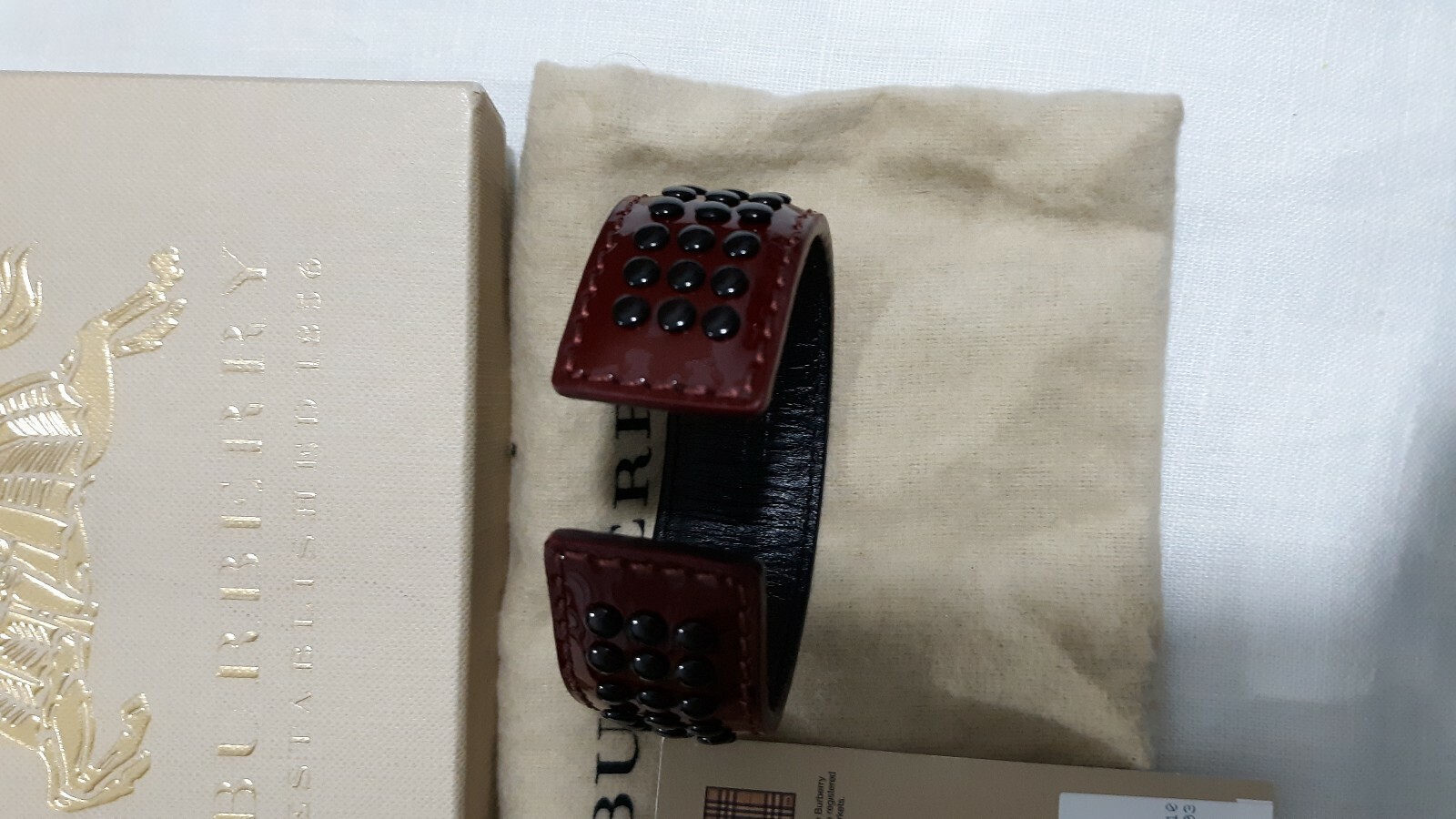 BURBERRY LEATHER CUFF BANGLE BERRY RED BLACK GROMMETS NEW TAGS UNISEX