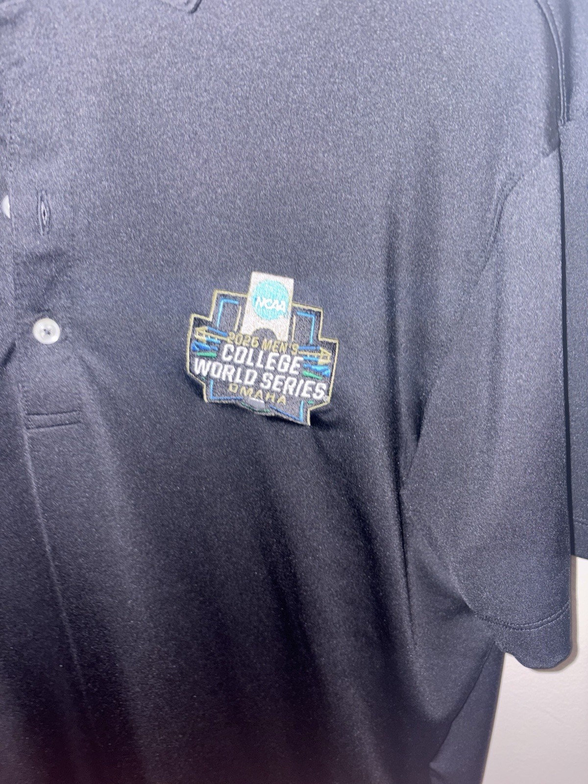 Johnnie-O Performance 2026 Men’s Black Polo Shirt M NCAA CWS Omaha Logo