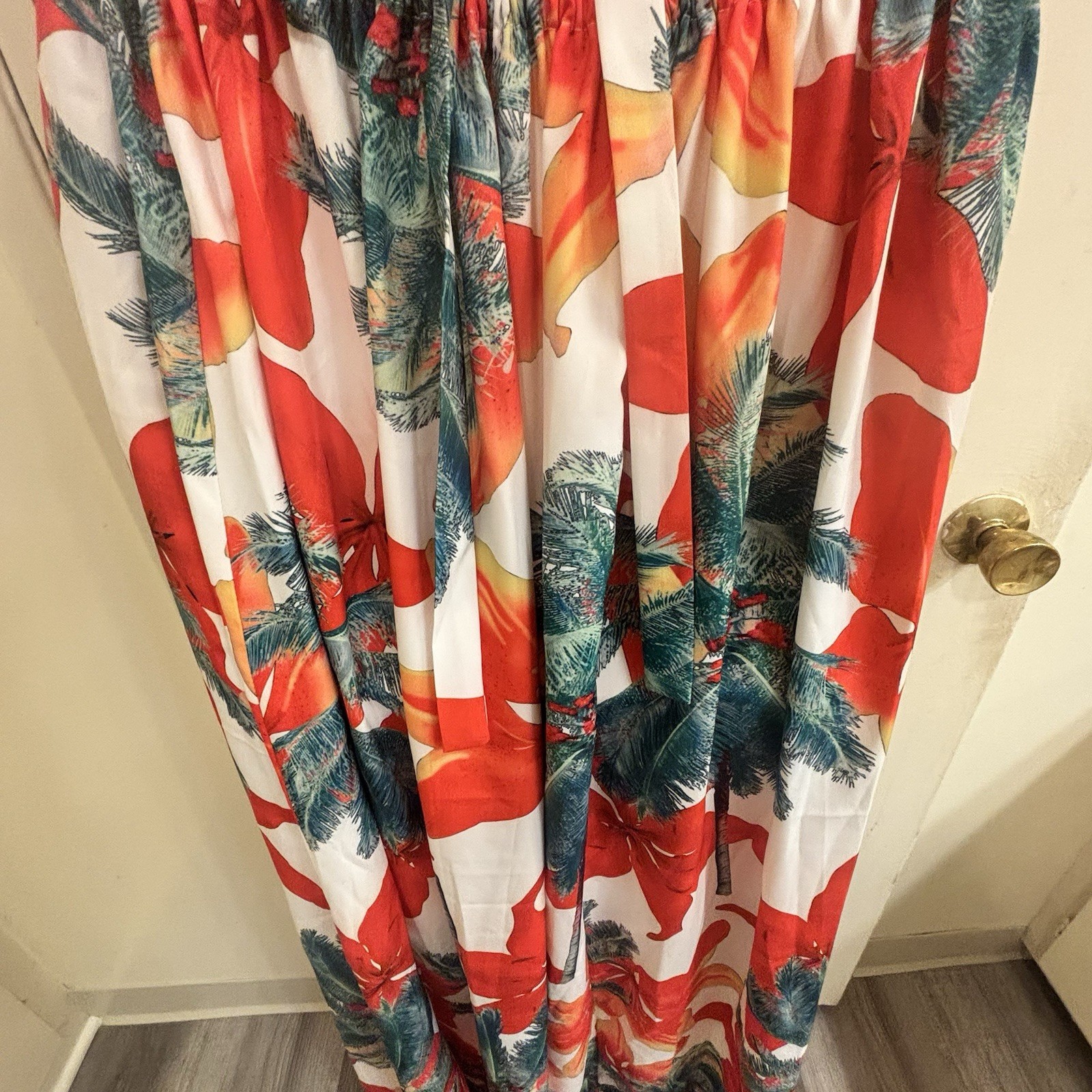 BeachCore tropical print halter maxi dress featuring gold chain cut-out details.