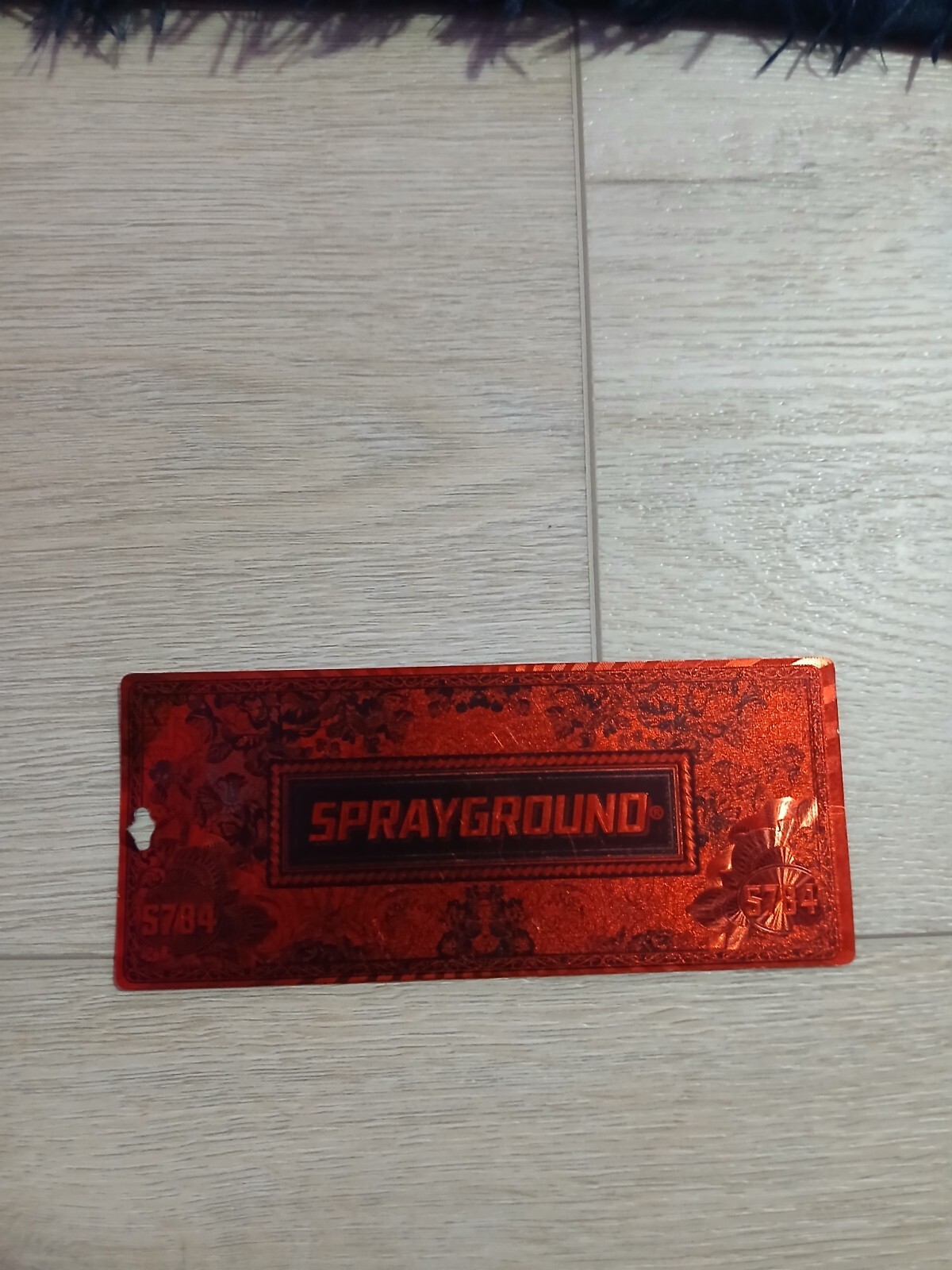 sprayground red tag
