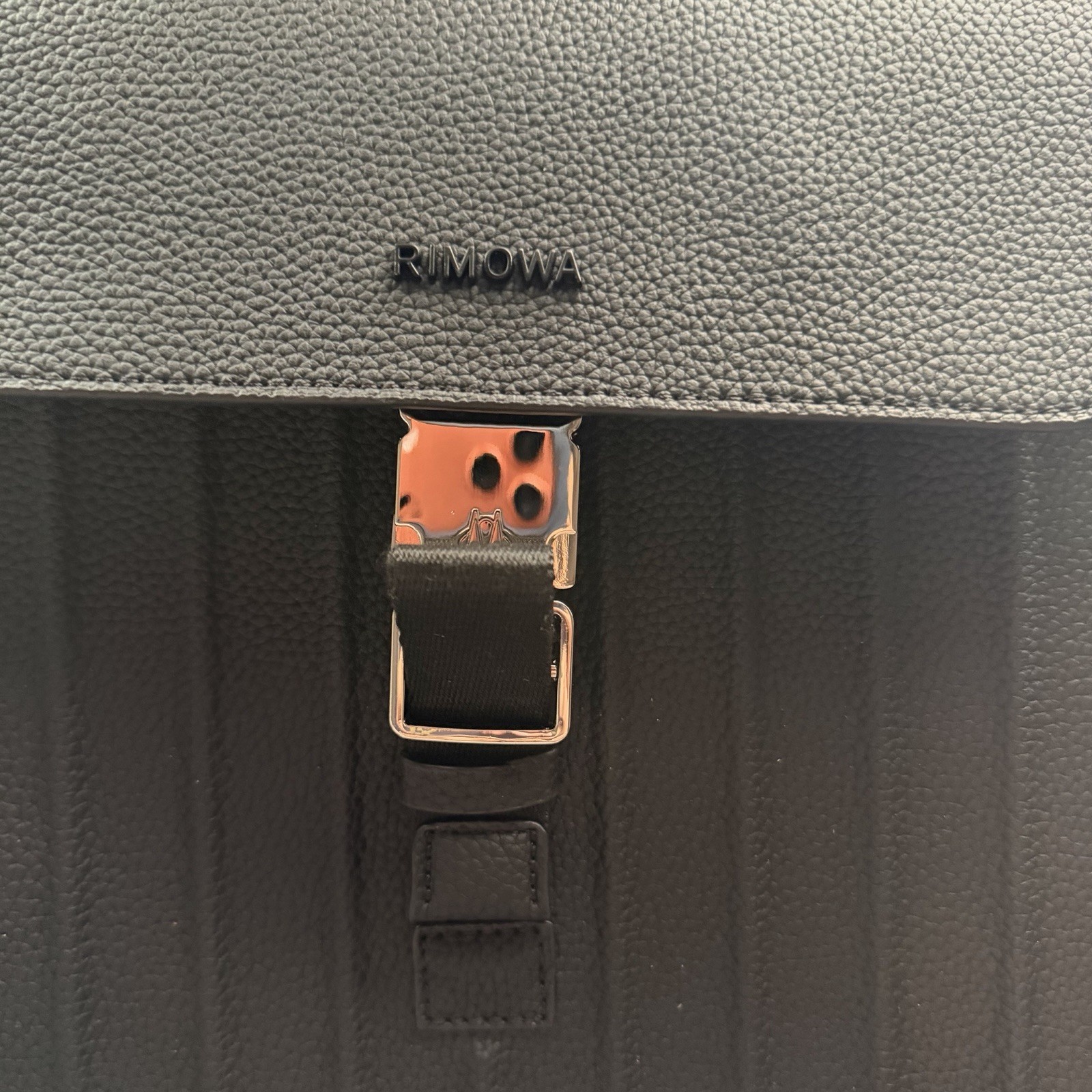 RIMOWA Black Backpack Drawstring Top Buckle Flap Zip Pockets Adjustable Straps