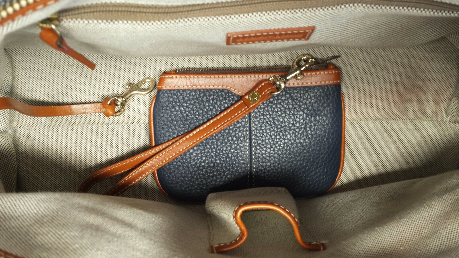 Dooney & Bourke Hand Bag golden hardware Color Navy Blue-cognac In Very Good C.