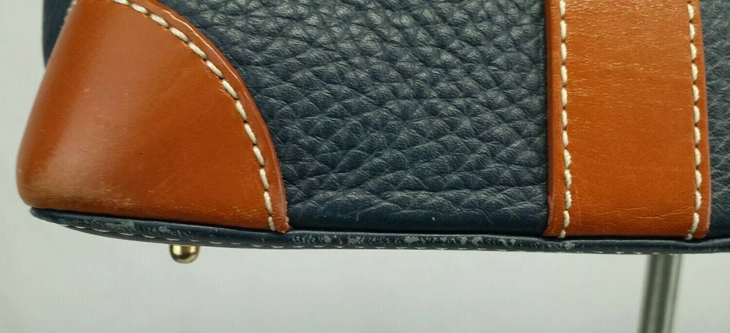 Dooney & Bourke Hand Bag golden hardware Color Navy Blue-cognac In Very Good C.