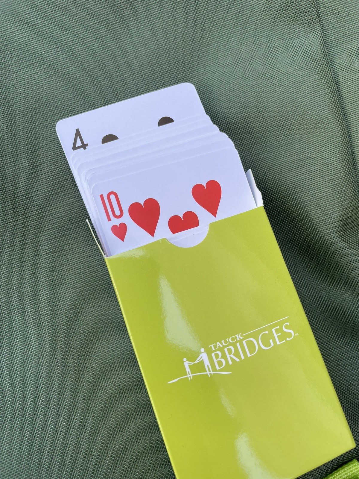 Pair of Tauck Bridges Green Foldable Backpacks with Playing Cards