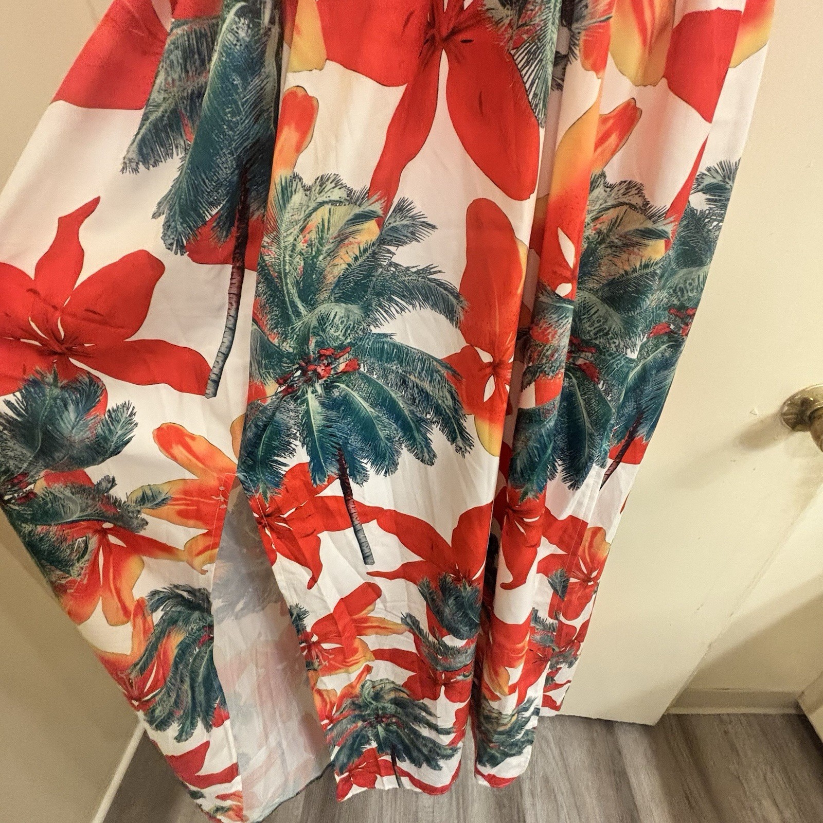 BeachCore tropical print halter maxi dress featuring gold chain cut-out details.