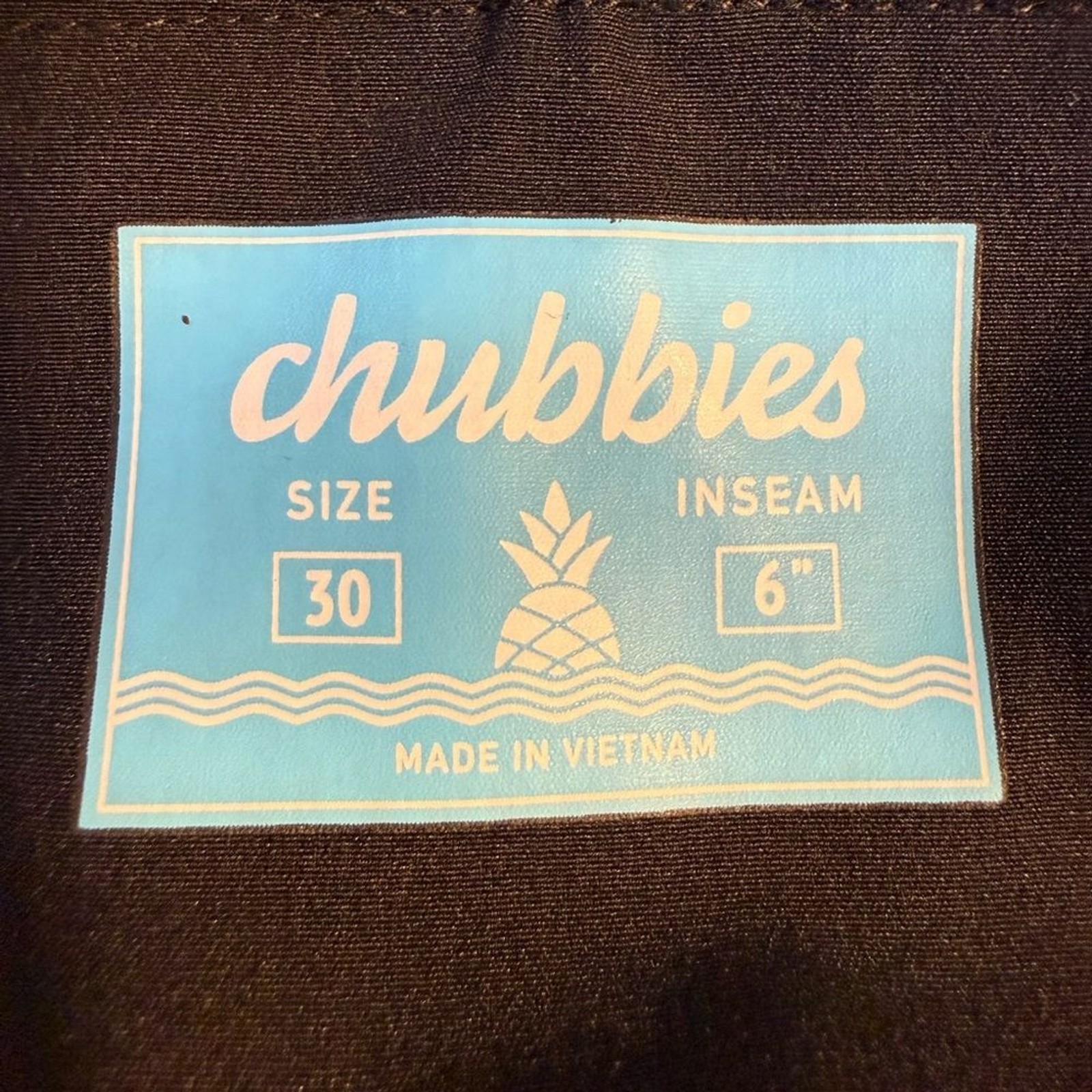 chubbies The Bloomerangs Black Swimwear with Coral and Teal Floral Trim
