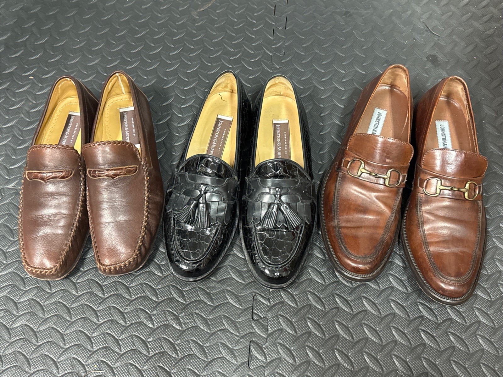 Three Pairs of Johnston and Murphy slip on shoes 9.5
