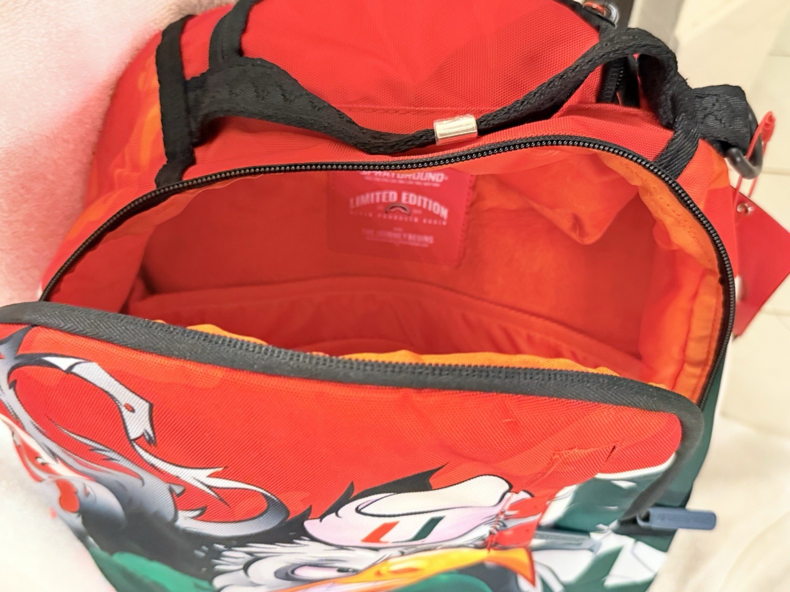 UM UNIVERSITY OF MIAMI FOOTBALL SPRAYGROUND BACKPACK MASCOT SEBASTIAN NEW IN BAG