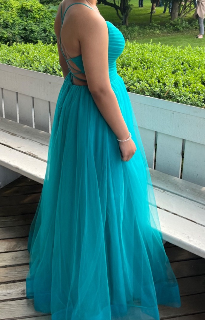 Size xs, formal dress for women. Turquoise in color, spaghetti straps that lace