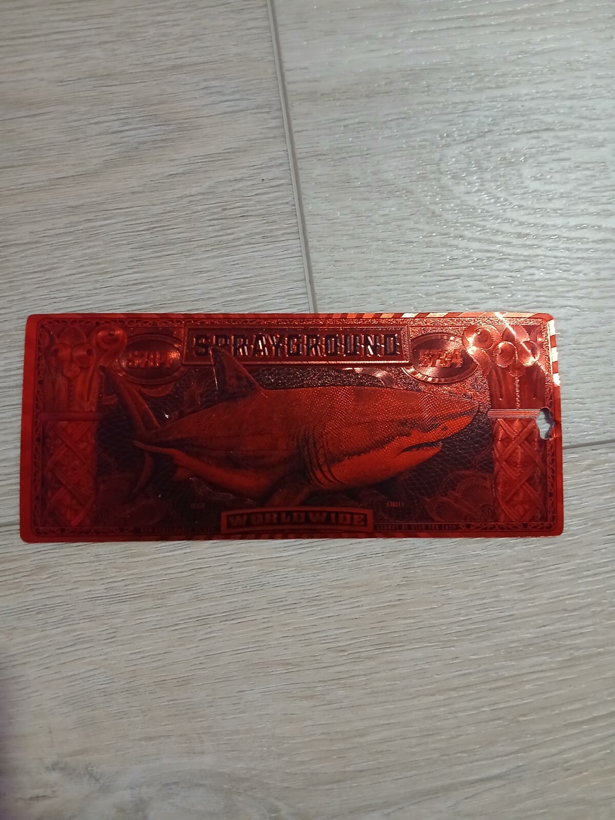 sprayground red tag