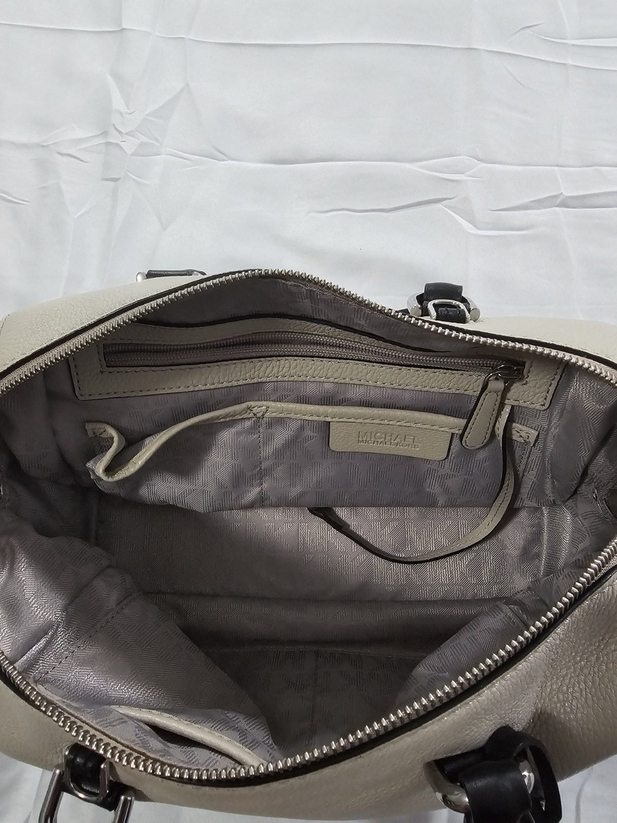 Michael Kors Kirby Large Leather Satchel feature Black Handles And Silver Logo