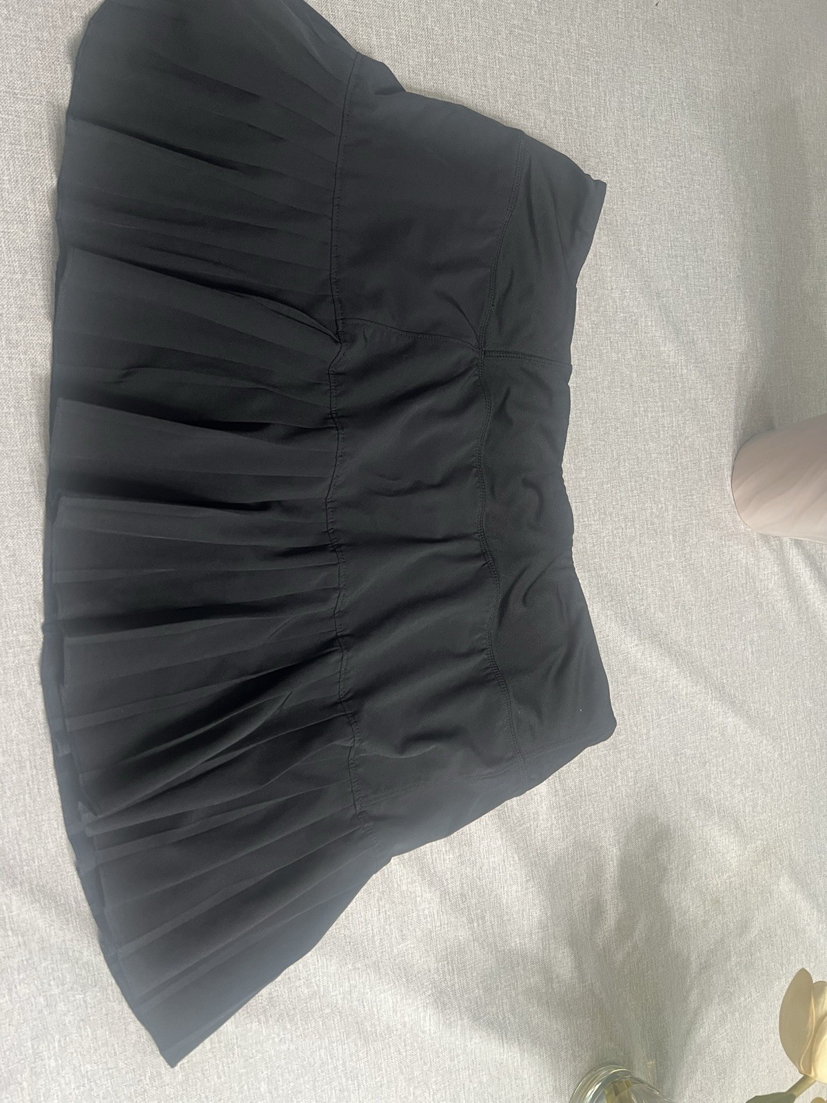 MPG branded black mini tennis Skirt With Built In Shorts. Smooth stretch fabric.