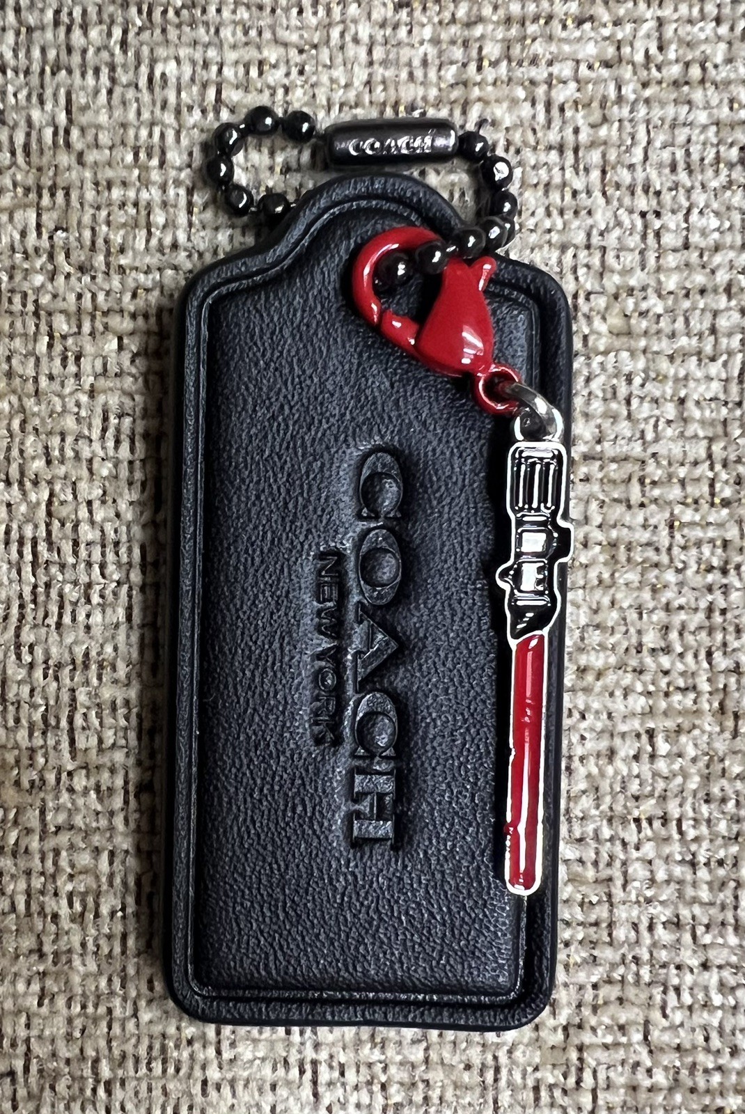 Coach Large 2.25” Black HangTag Star Wars Sith / Jedi Red Light Saber Charm New