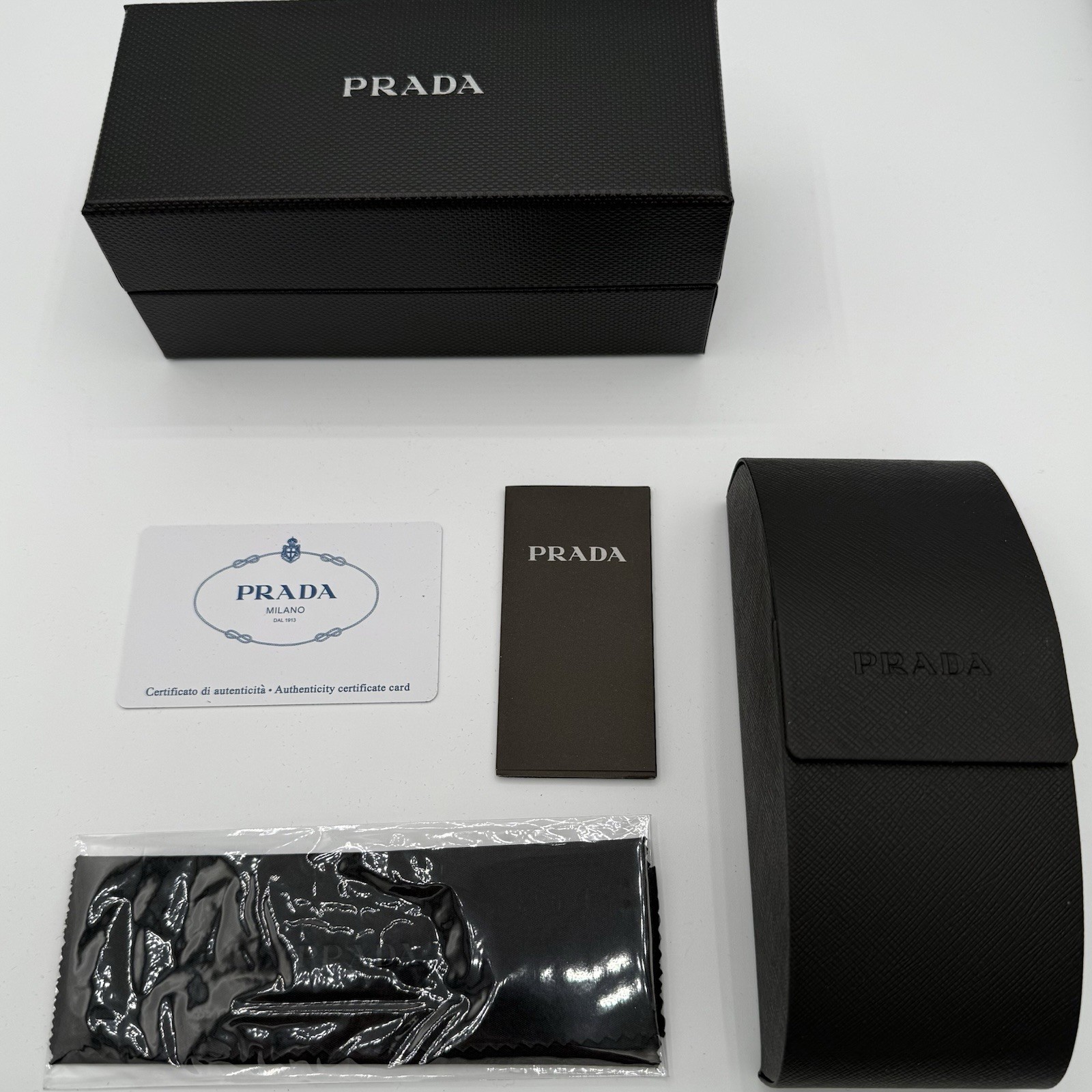 Prada PR 09ZS 1AB5S0 Unisex Sunglasses – Black/Gray