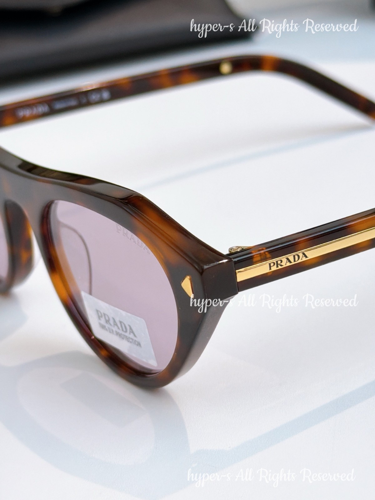Prada SPR B15 Women Sunglasses Cat Eye Tortoiseshell Frame Purple Lenses UV400