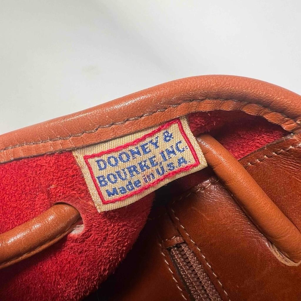 Dooney & Bourke Classic Collection All Weather Pebble Leather Red Tan Backpack