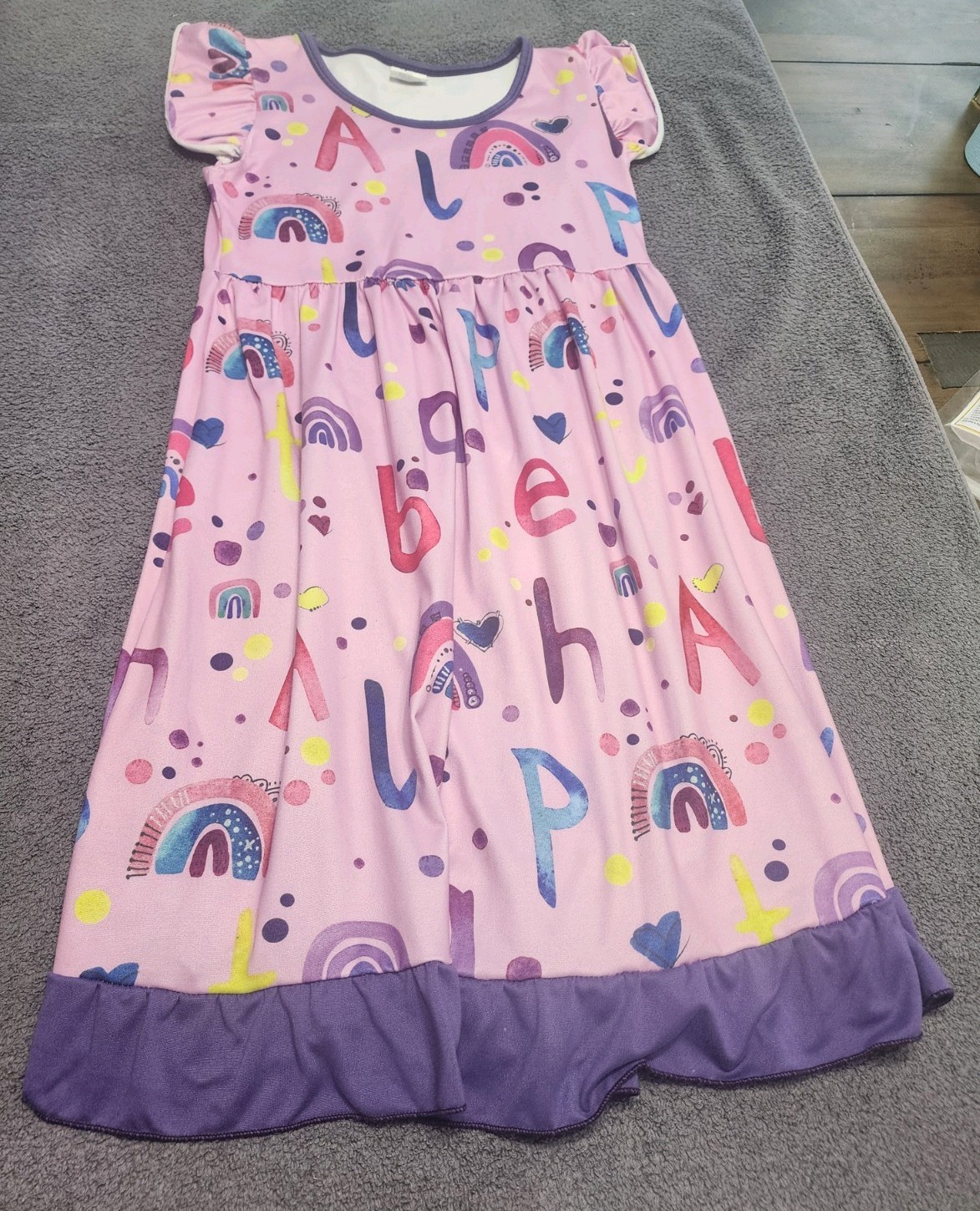3XL. 3 girls’ dresses(pink-rainbows, yellow-apples, White-pencils) $24 Age 7–8