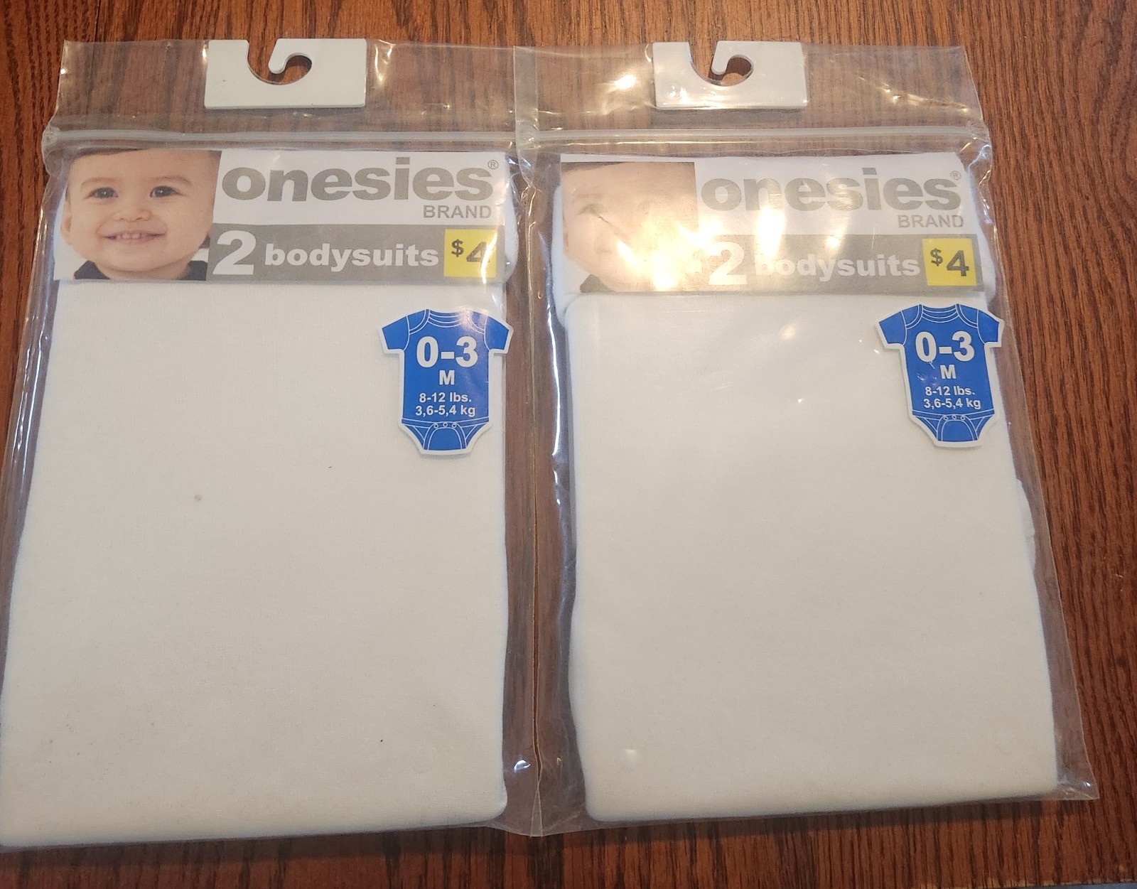 NIP Two Packs Of Plain White Baby Body Suits Size 0-3 Months