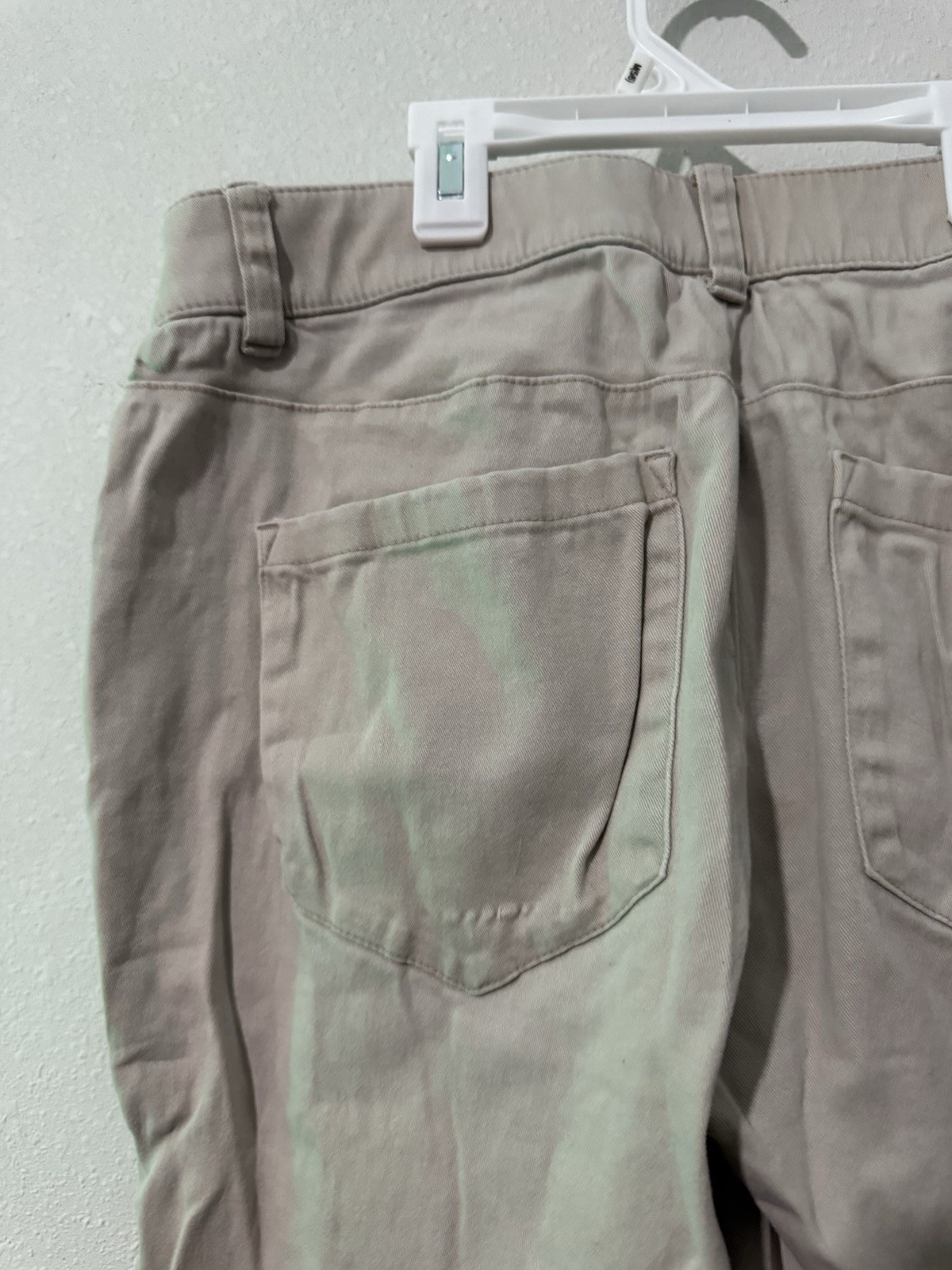 cotton twill chinos, featuring a zipper fly and button closure