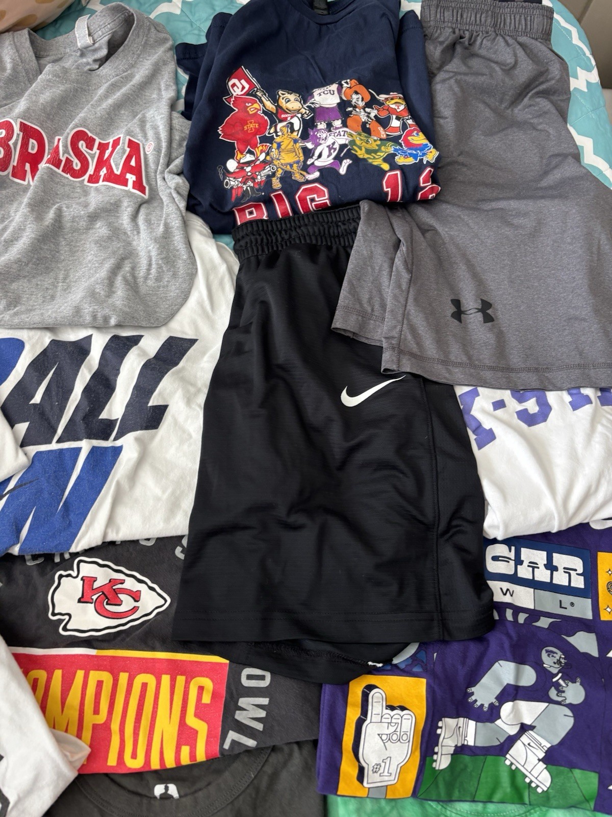 Lot of Sport Clothing. Sizes Vary. Most Shirts are Large and Shorts a S. Nike