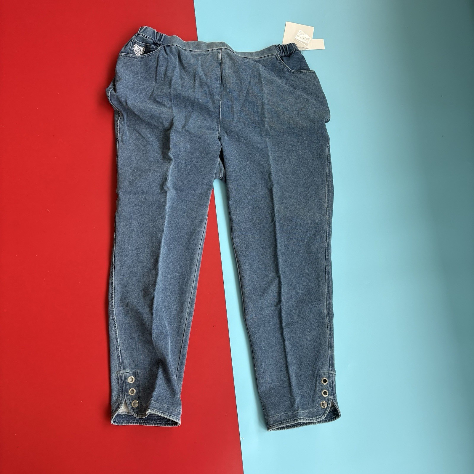 Quacker Factory DreamJeannes Women’s 1X Pull-On Denim Knit Jeans Blue Grommet