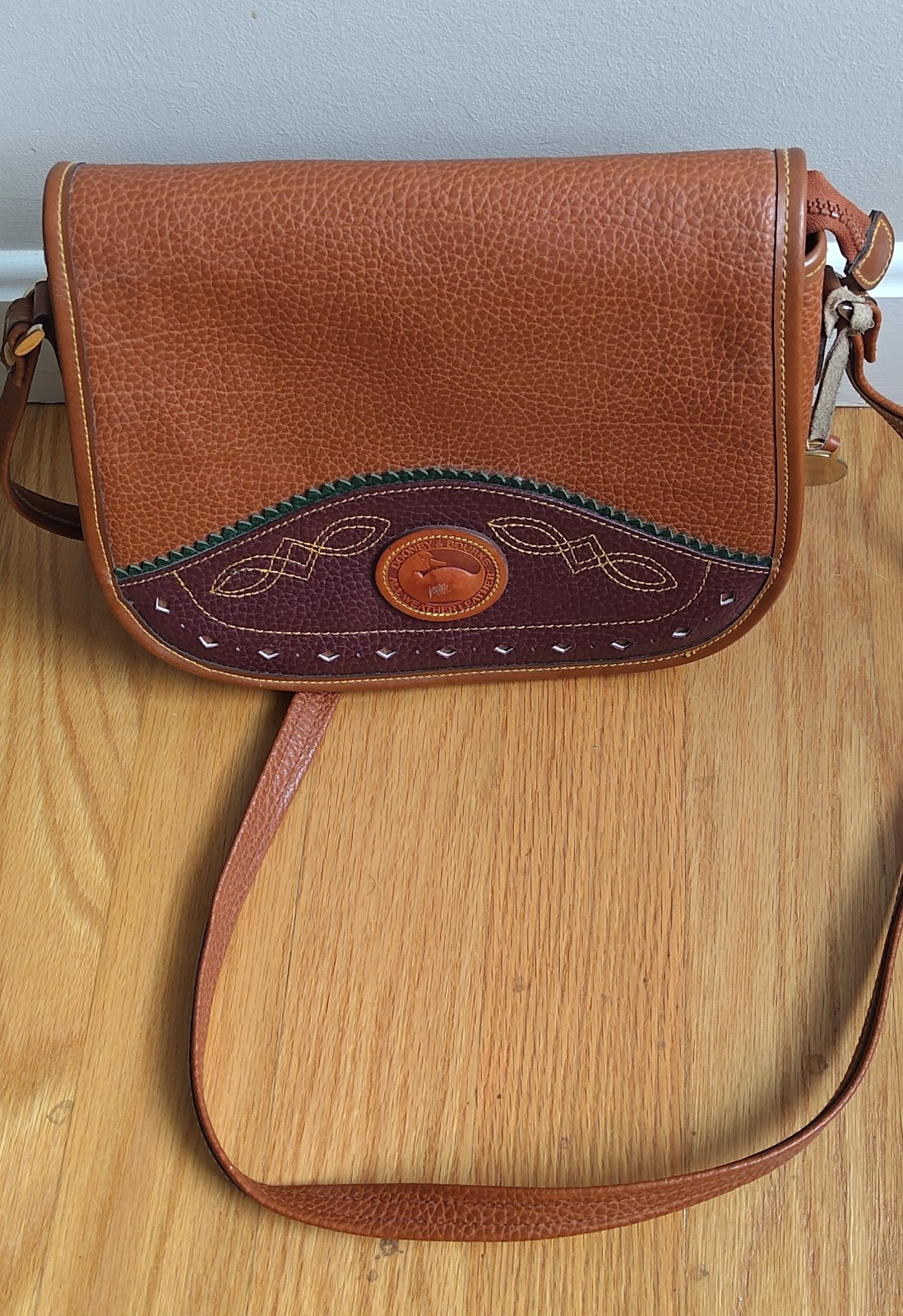 Dooney & Bourke All Weather Leather Duck Bag Color = Brown