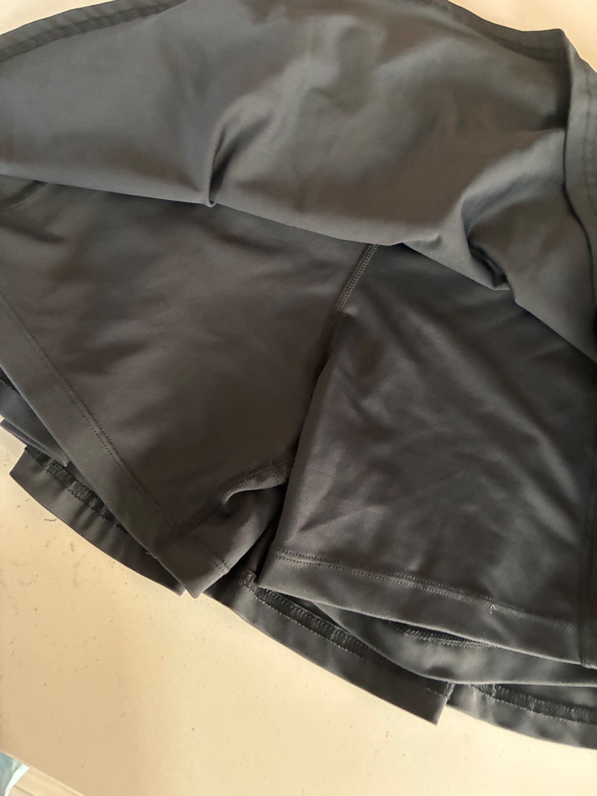 CVG Constantly Varied Gear Black Skort with zipper pocket at back