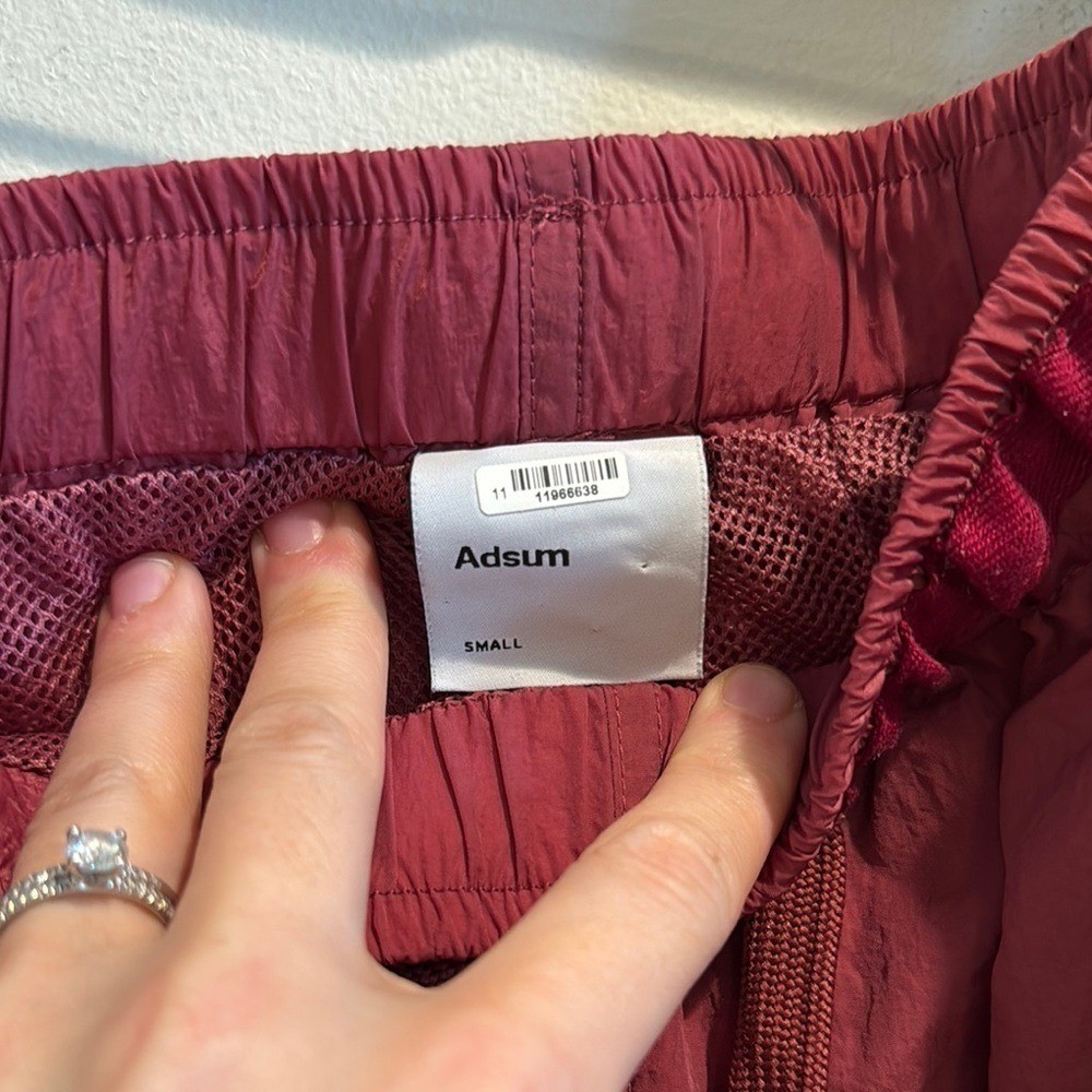 Adsum Effo Nylon Drawstring Shorts in the color raspberry