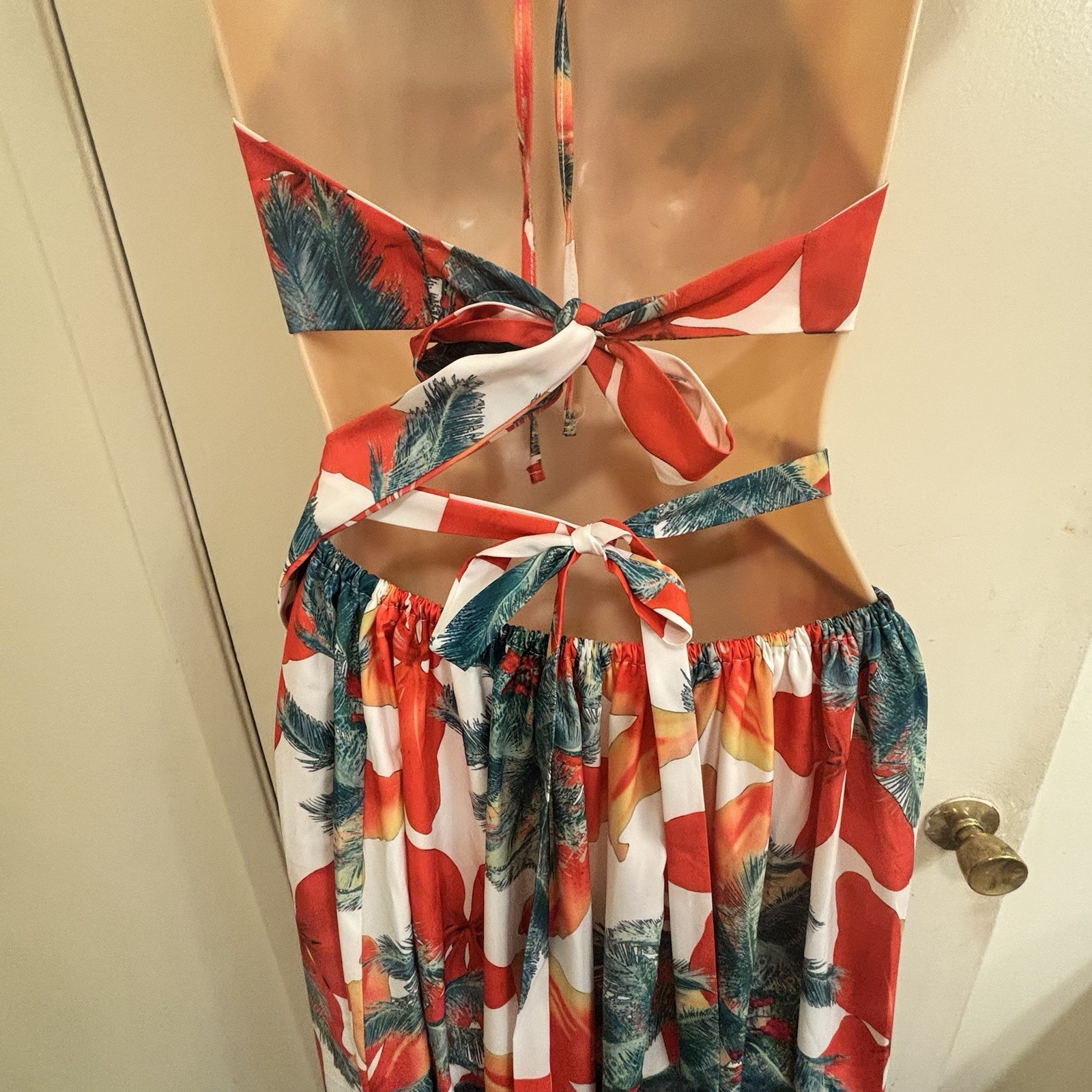 BeachCore tropical print halter maxi dress featuring gold chain cut-out details.