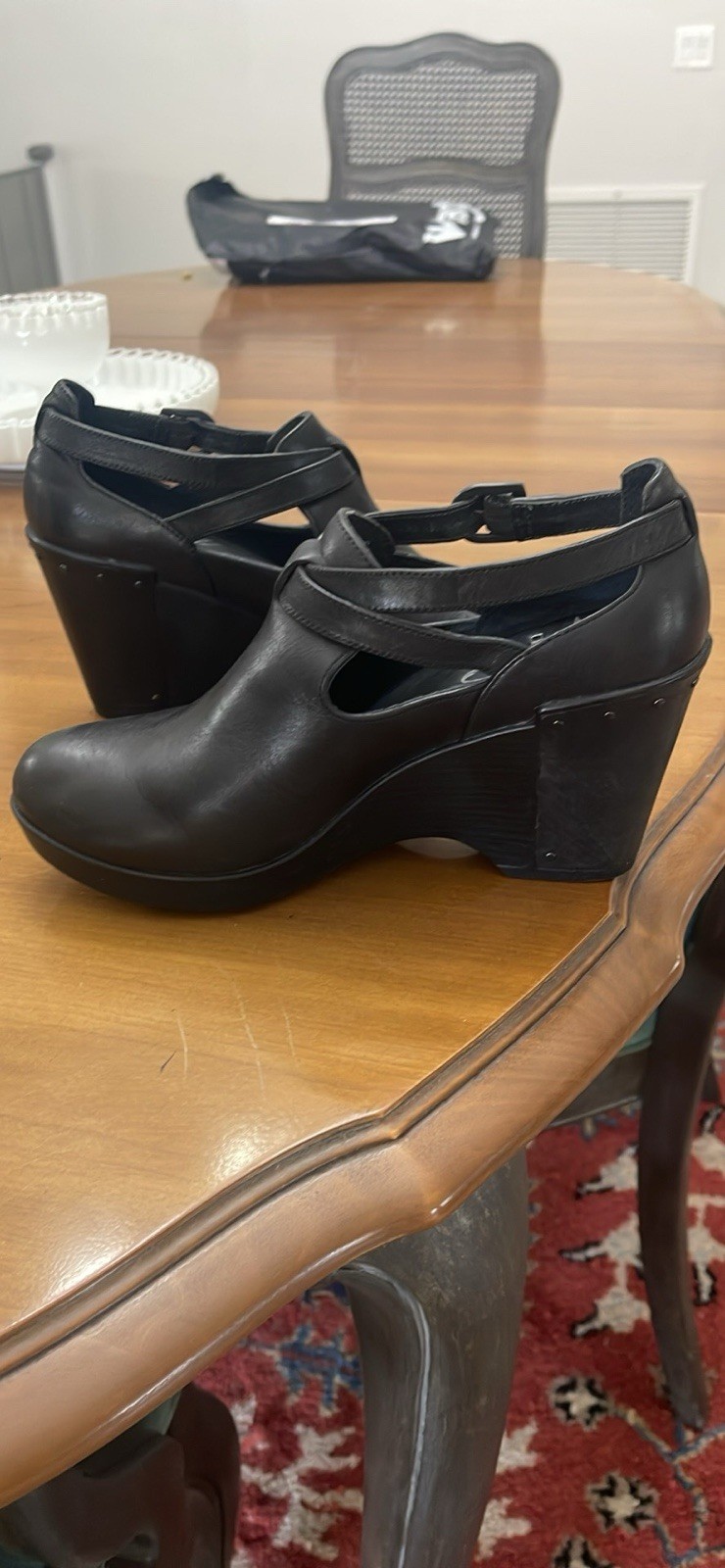 Dansko 37 Black Clogs with Buckle Strap and Metal Tooling on the Heel