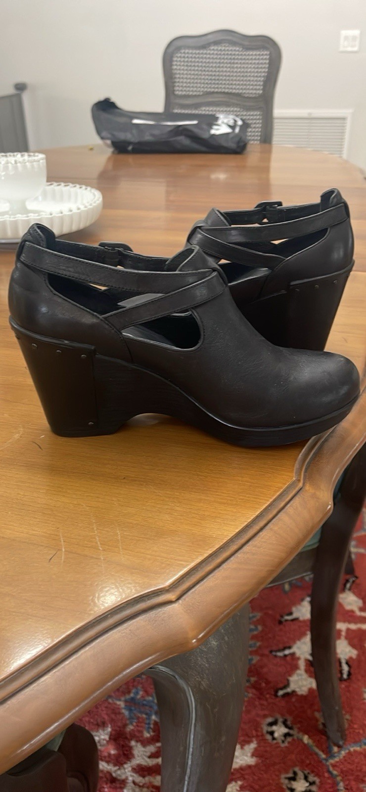 Dansko 37 Black Clogs with Buckle Strap and Metal Tooling on the Heel