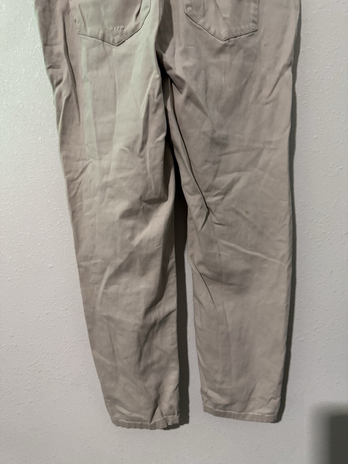 cotton twill chinos, featuring a zipper fly and button closure