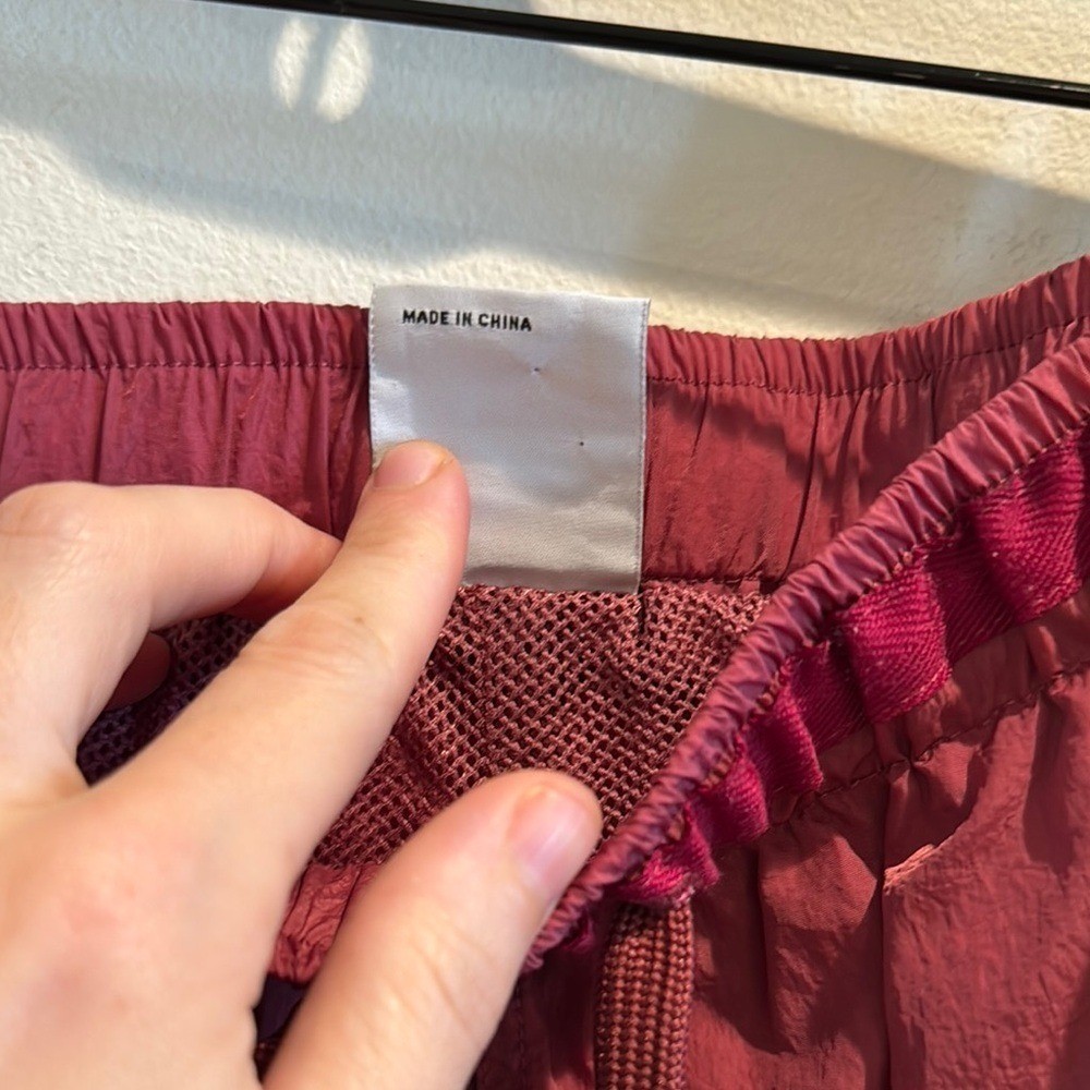 Adsum Effo Nylon Drawstring Shorts in the color raspberry