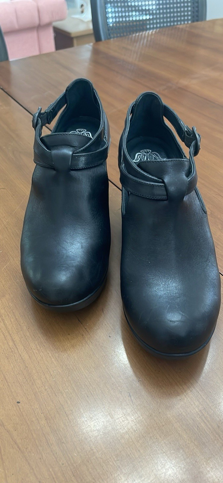 Dansko 37 Black Clogs with Buckle Strap and Metal Tooling on the Heel