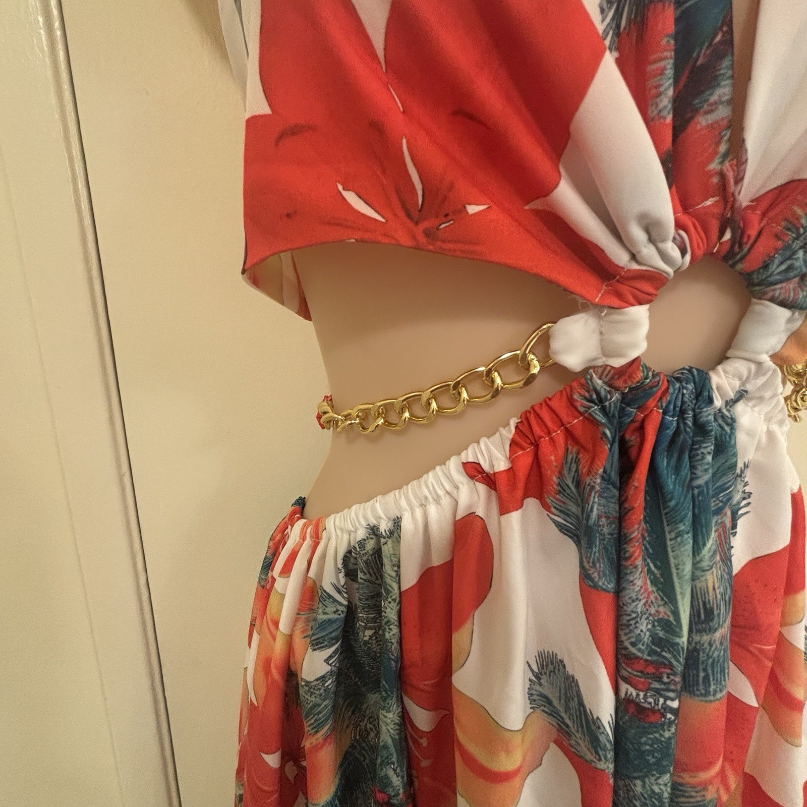 BeachCore tropical print halter maxi dress featuring gold chain cut-out details.