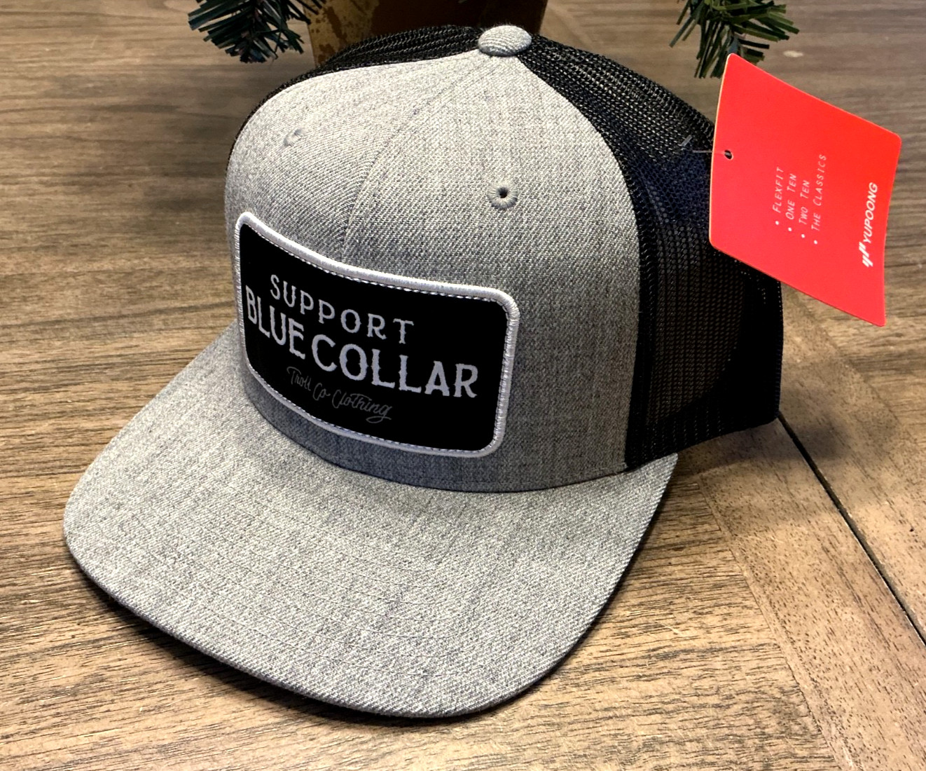 SUPPORT BLUE COLLAR. TROLL CO.CLOTHING SNAPBACK TRUCKER HAT. TAG. 7-1/8”GREY/BLK