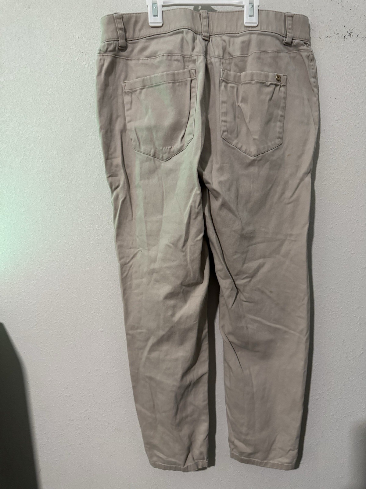 cotton twill chinos, featuring a zipper fly and button closure